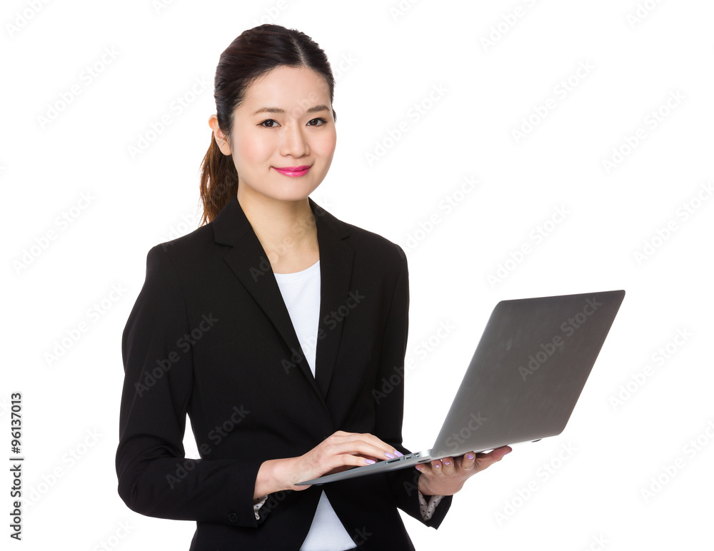 Asian Businesswoman use of the notebook computer Asian Businesswoman use of the notebook computer