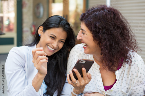 Companions laughing at texts