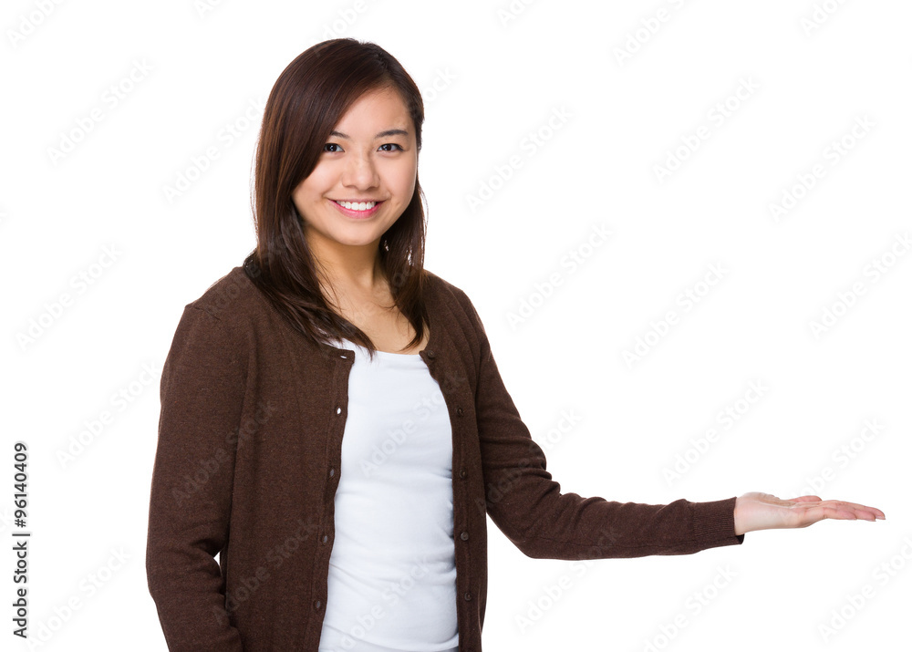 Young Woman with hand showing blank sign Young Woman with hand showing blank sign