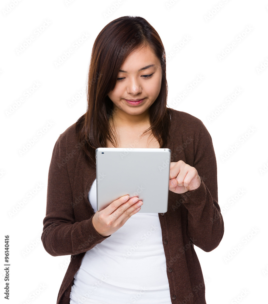 Asian Young Woman use of the tablet pc Asian Young Woman use of the tablet pc