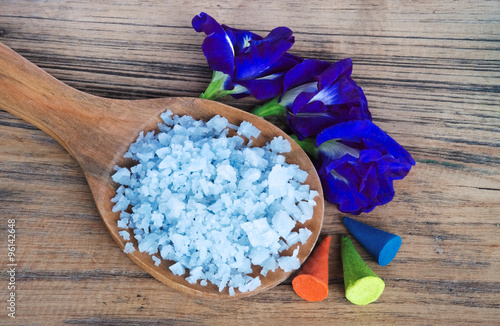 Butterfly pea salt spa, blue pea salt spa, herb spa on wooden spoon on wood background with aroma cones