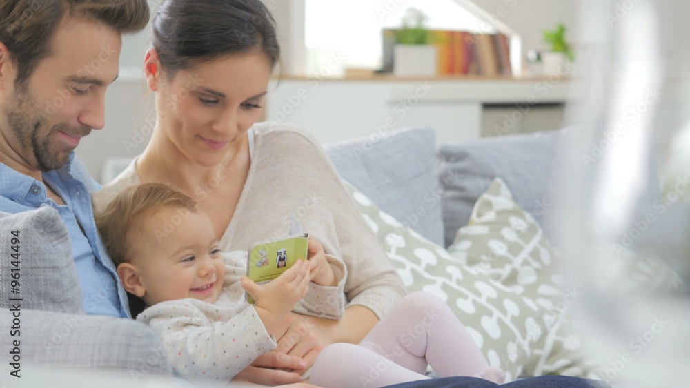 Portrait of happy young family of three