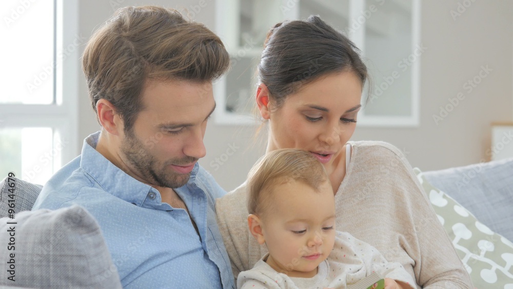 Portrait of happy young family of three Portrait of happy young family of three