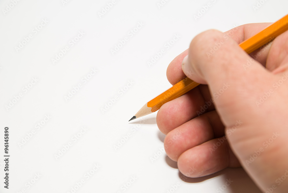 Men's right hand holding a pencil on over white Men's right hand holding a pencil on over white