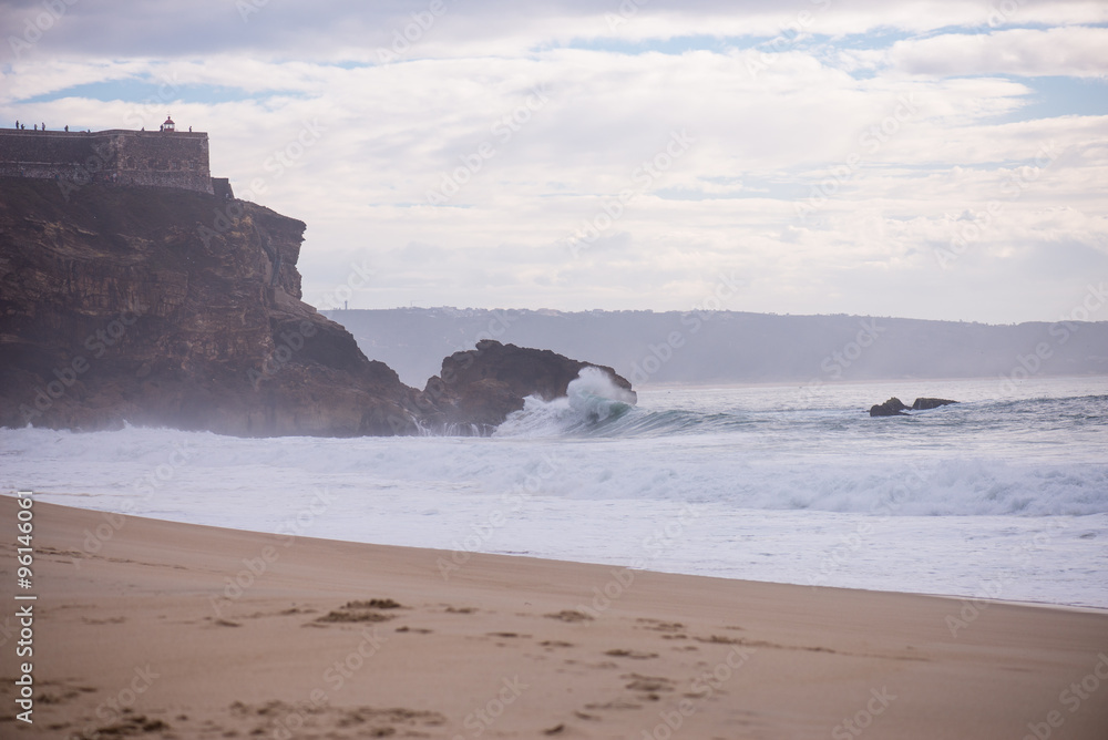 Wave crashing on a coast in Nazare, Portugal. Wave crashing on a coast in Nazare, Portugal.