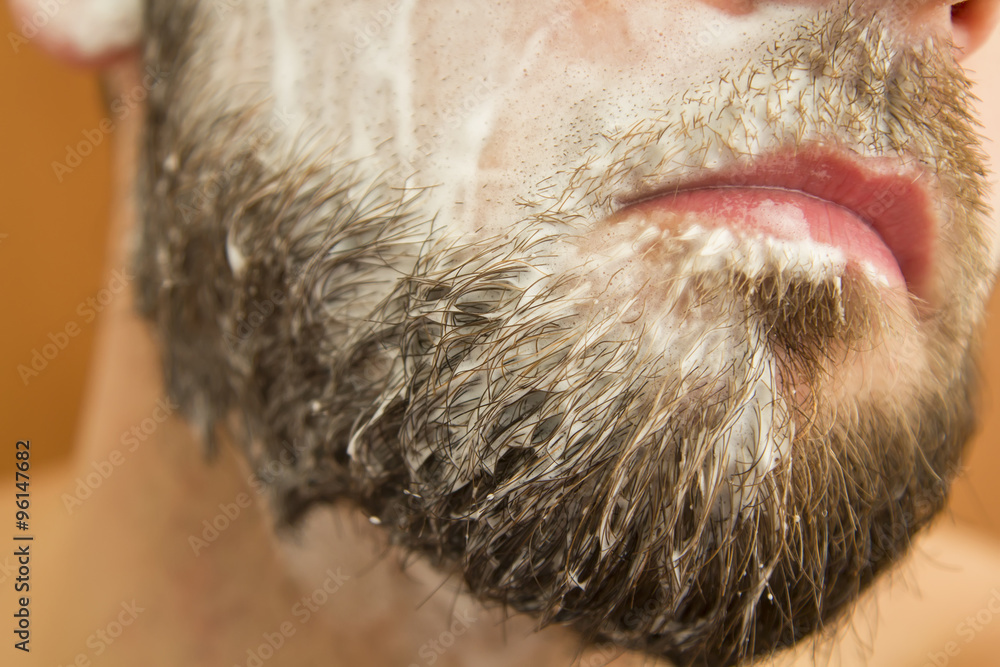 Closeup of beard man with soap on face Closeup of beard man with soap on face