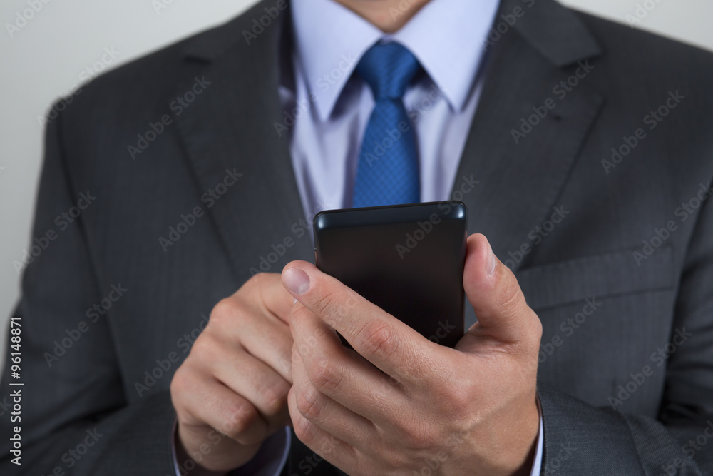 Close up of business man hands holding mobile phone Close up of business man hands holding mobile phone
