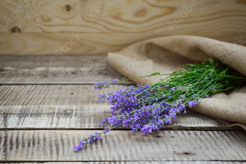 Fototapeta Naklejka Na Ścianę i Meble -  lavender fresh bunch on wooden and sackcloth background