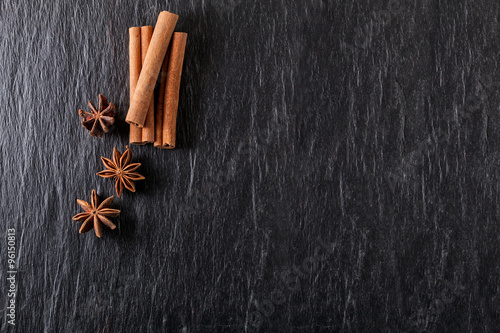 Cinnamon sticks, anise on a stone plate