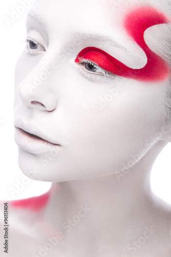 Art fashion girl with white skin and red paint on the face. Creative art beauty