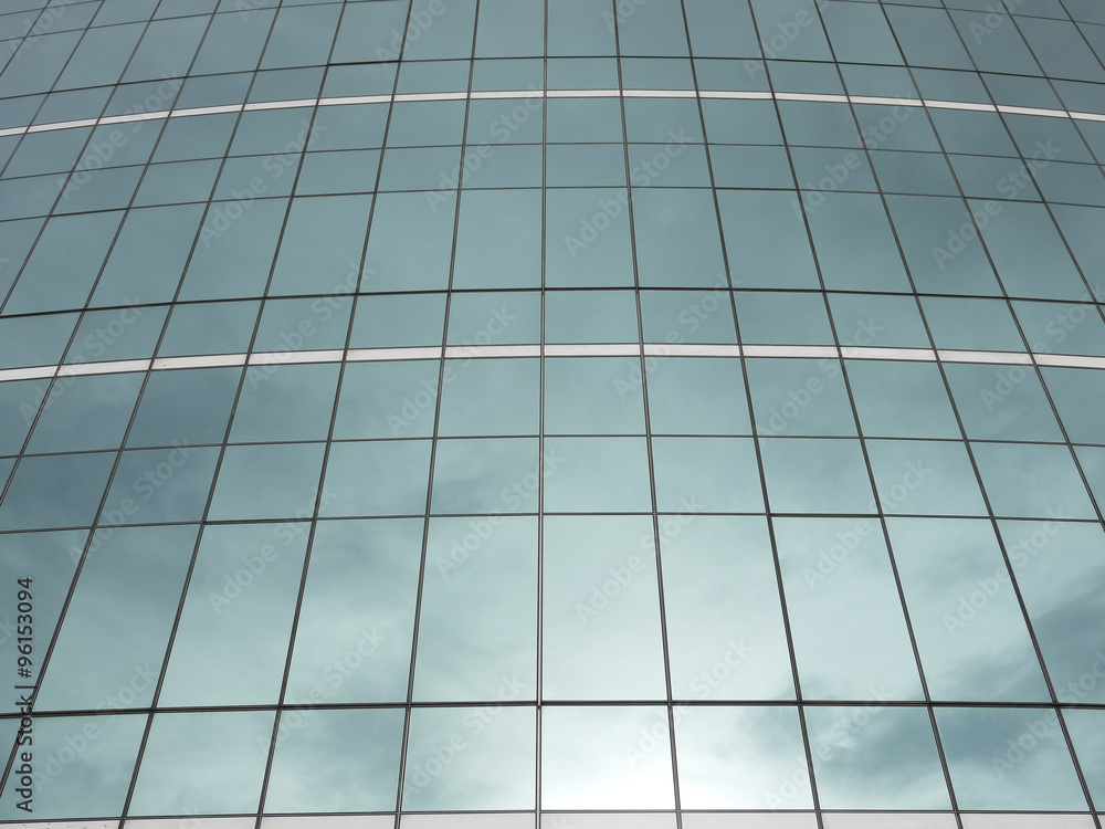highrise glass building with sky and clouds reflection highrise glass building with sky and clouds reflection