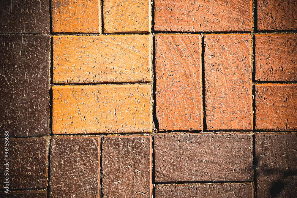 Fototapeta premium Fragment of red brick wall for background. Toned