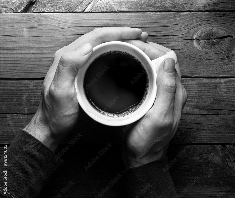 Hands Holding Coffee Cup