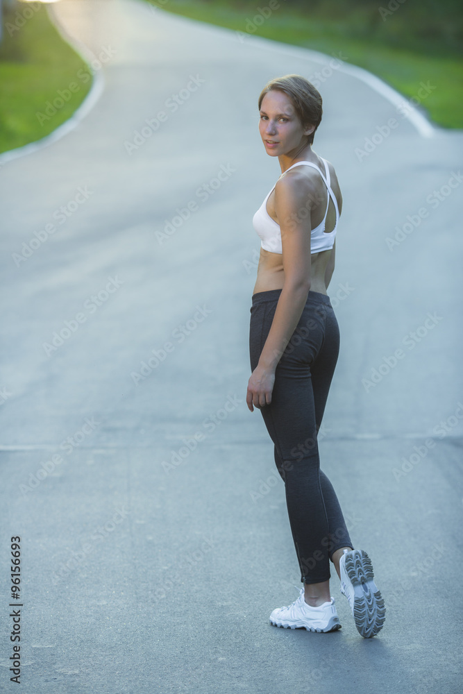 Fototapeta premium young woman stopped while jogging