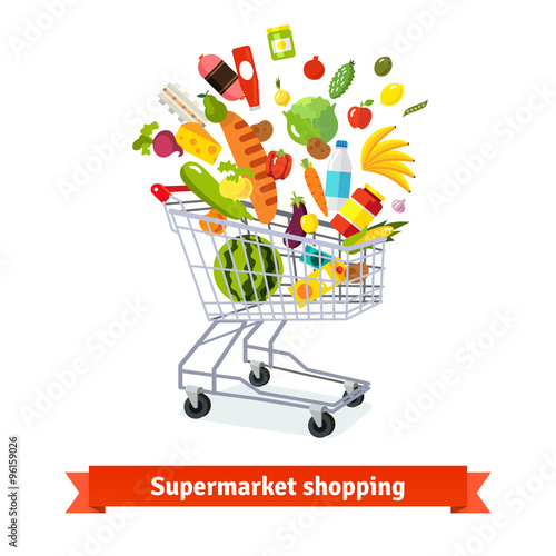 Full shopping grocery cart exploding with goods
