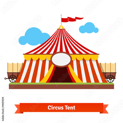 Open circus tent with wagon wheel in the back