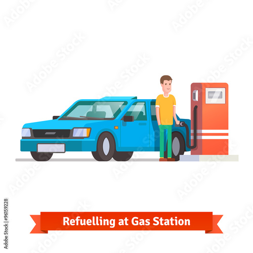 Man refuelling his car at petrol station