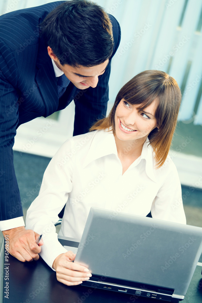 Two business people working with laptop Two business people working with laptop