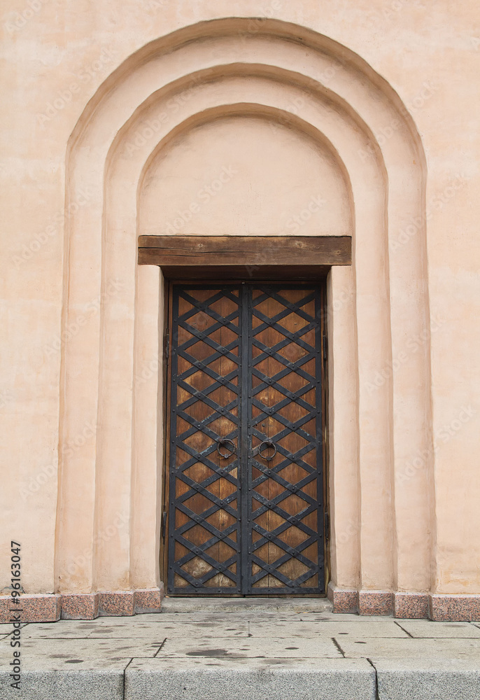 Ancient door in the Christian church. Architecture