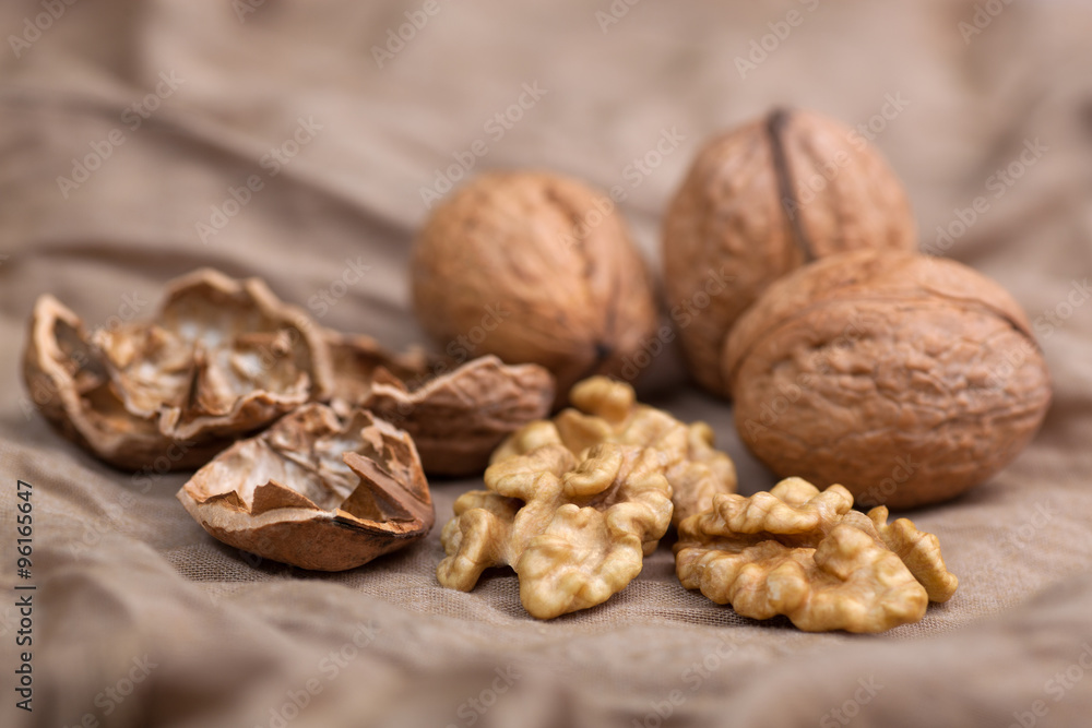 Walnut without shell close-up, and nuts in the shell Walnut without shell close-up, and nuts in the shell