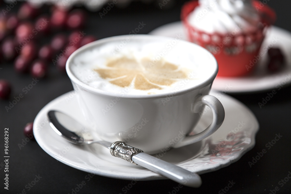 cappuccino and muffin with cream and cranberries . cappuccino and muffin with cream and cranberries .