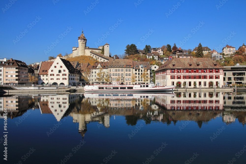 Munot and other buildings in Schaffhausen mirroring in the Rhine Munot and other buildings in Schaffhausen mirroring in the Rhine