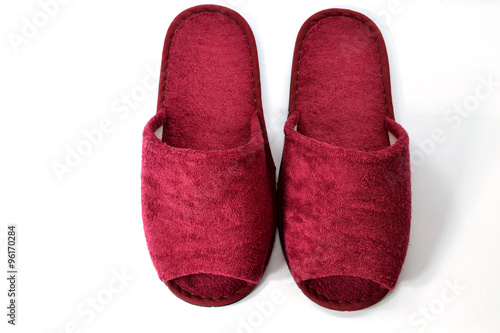 Red slipper on white background on top view