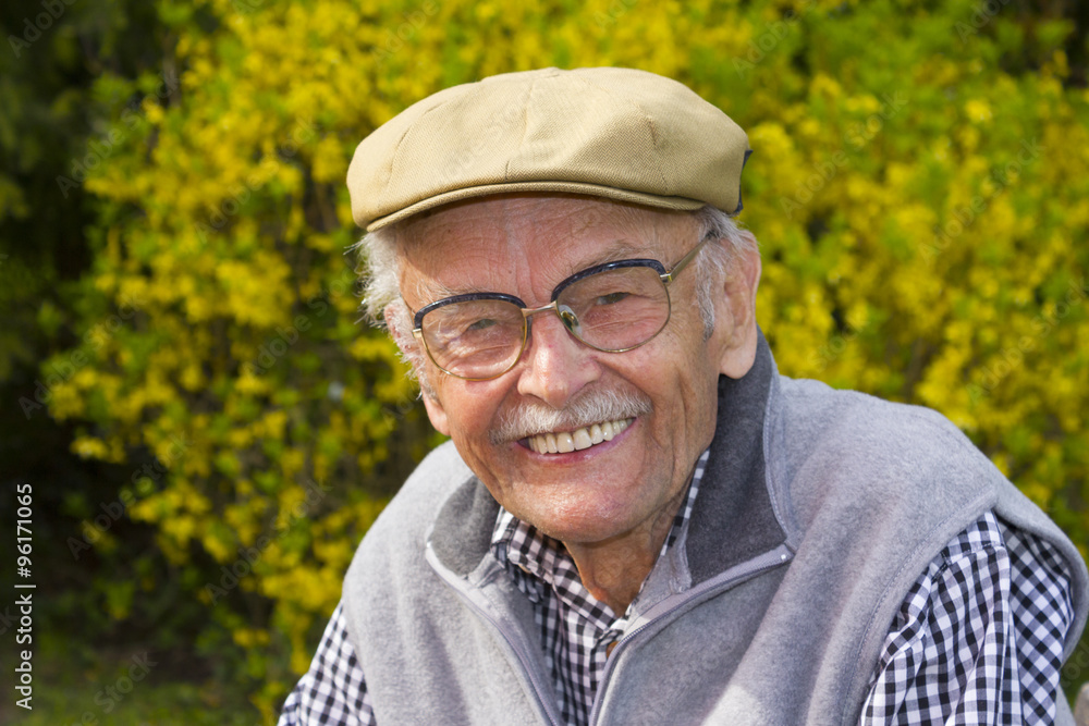 Profile on a Smiling Old Man With a Grey Beard