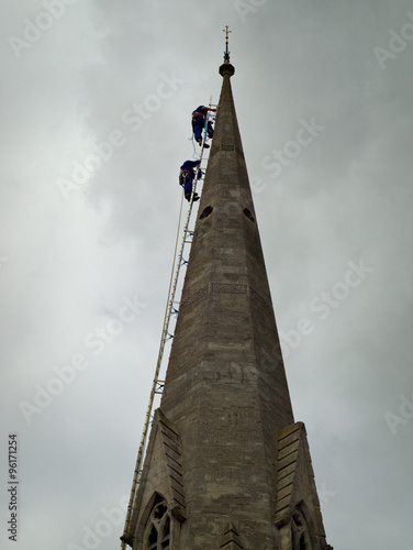 Steeplejacks on church roof