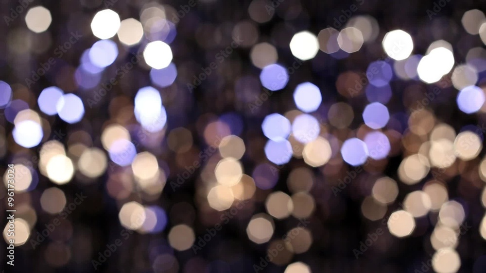 Abstract glittering lights, silver background, a real shot video in the blur Abstract glittering lights, silver background, a real shot video in the blur