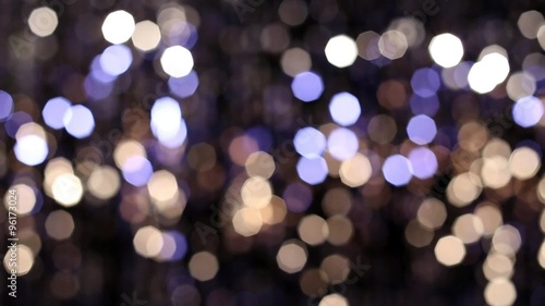 Abstract glittering lights, silver background, a real shot video in the blur