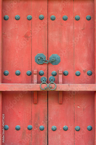 Red gate with a bar