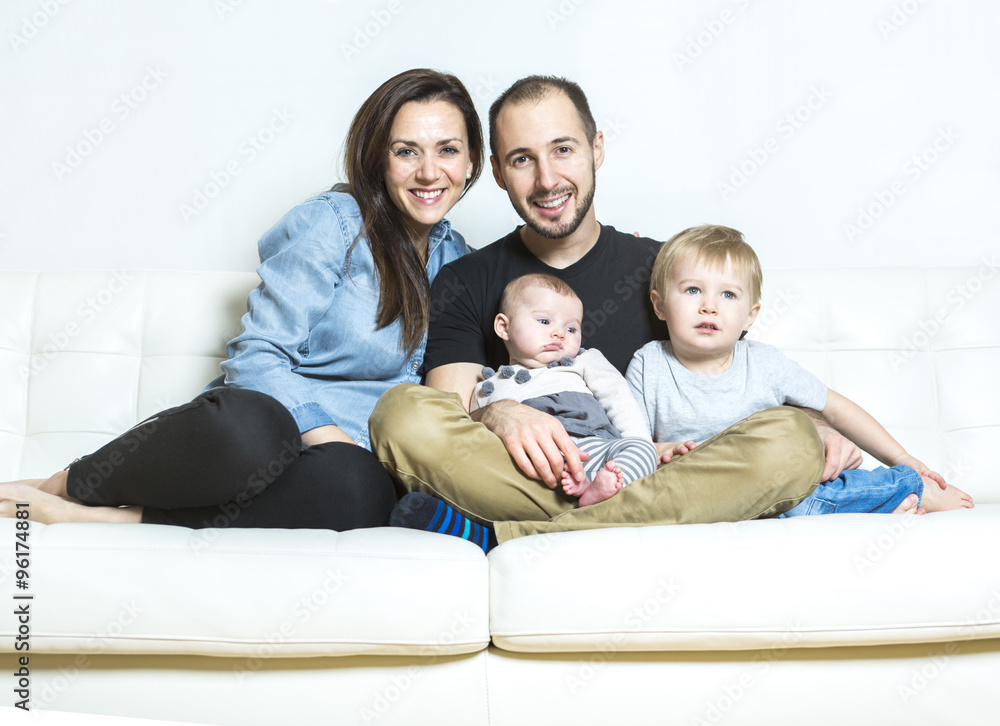 Young happy family with two children at home Young happy family with two children at home