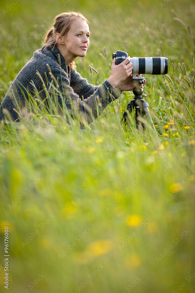 Pretty young woman with a DSLR camera outdoors Pretty young woman with a DSLR camera outdoors