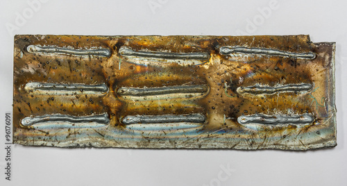 Fotografi welding seam onto steel sheet metal Industrial steel welder in factory