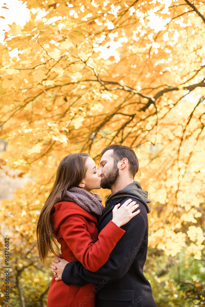 Nice concept for young couple in autumn park Nice concept for young couple in autumn park
