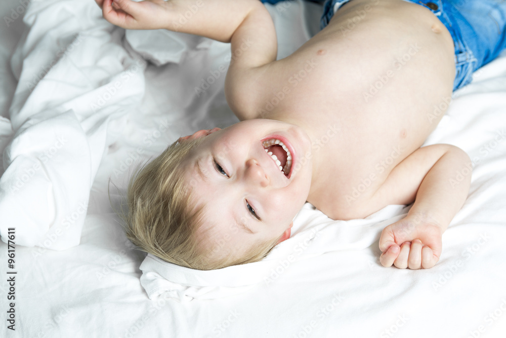 Healthy Lifestyle of young little children boy on bed Healthy Lifestyle of young little children boy on bed