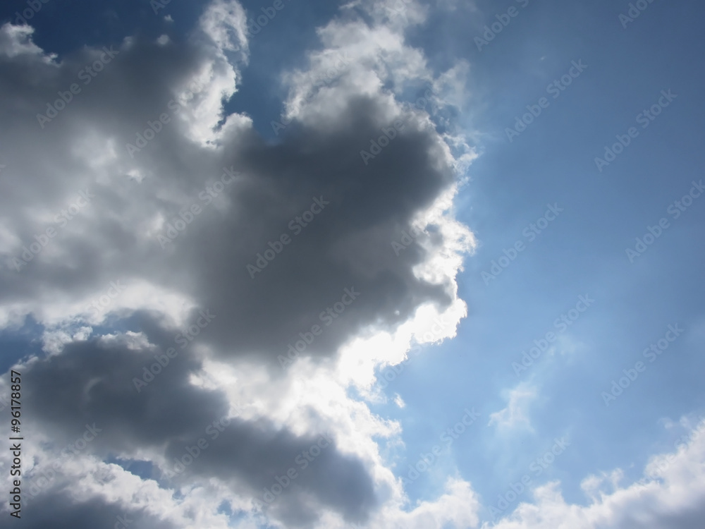 Sky with giants cumulonimbus clouds and sun rays through Sky with giants cumulonimbus clouds and sun rays through