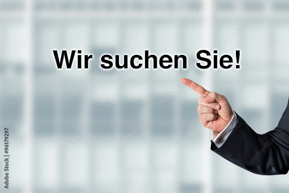 Business man pointing at the words We are looking for employees Business man pointing at the words We are looking for employees