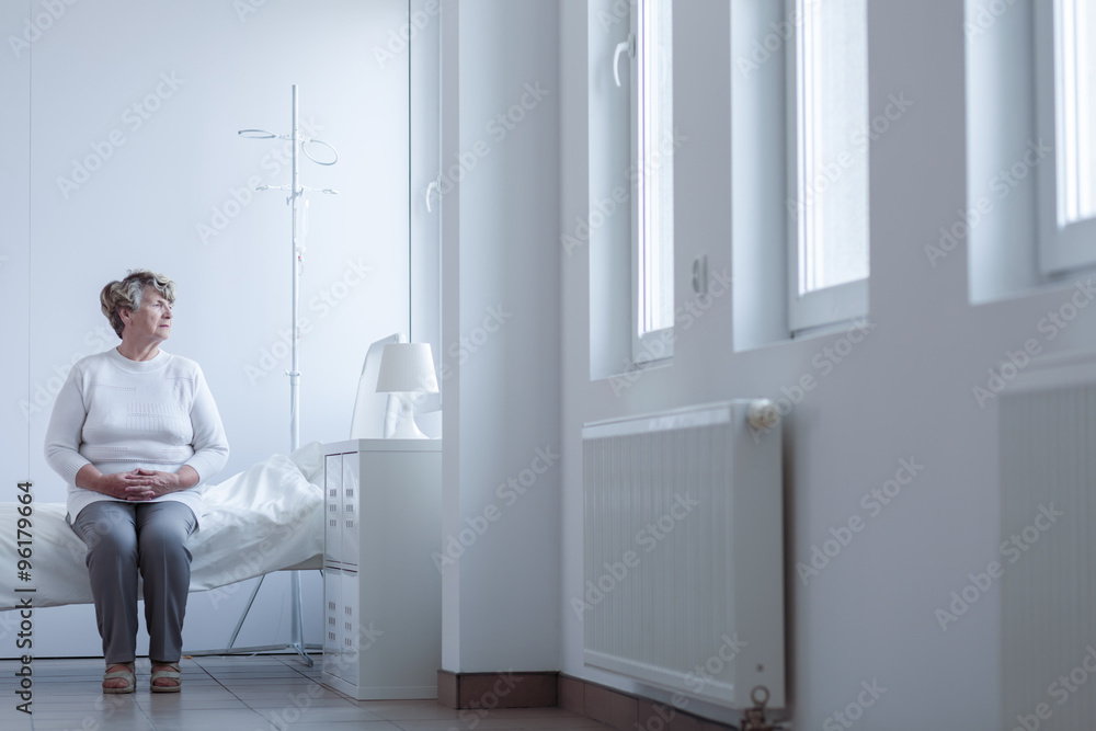 Senior patient sitting on bed Senior patient sitting on bed
