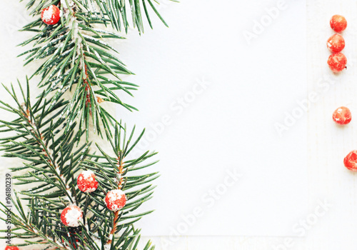 Natural fir tree twig festive decor border on white empty background card