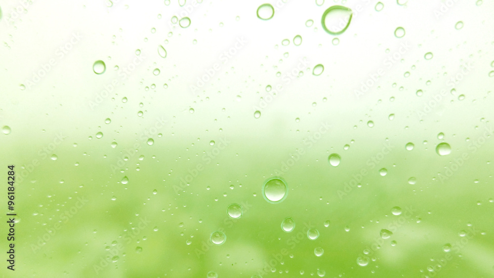 Close-up of water drops on glass surface as background