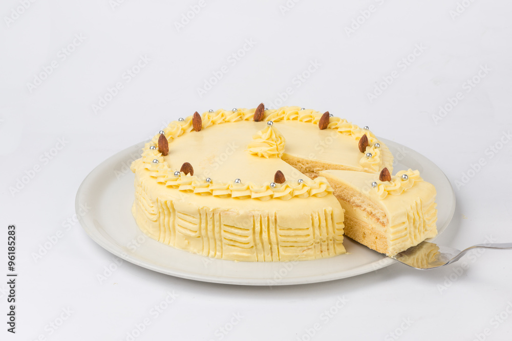 Homemade banana cake served on a white plate. Studio shot on white background Homemade banana cake served on a white plate. Studio shot on white background