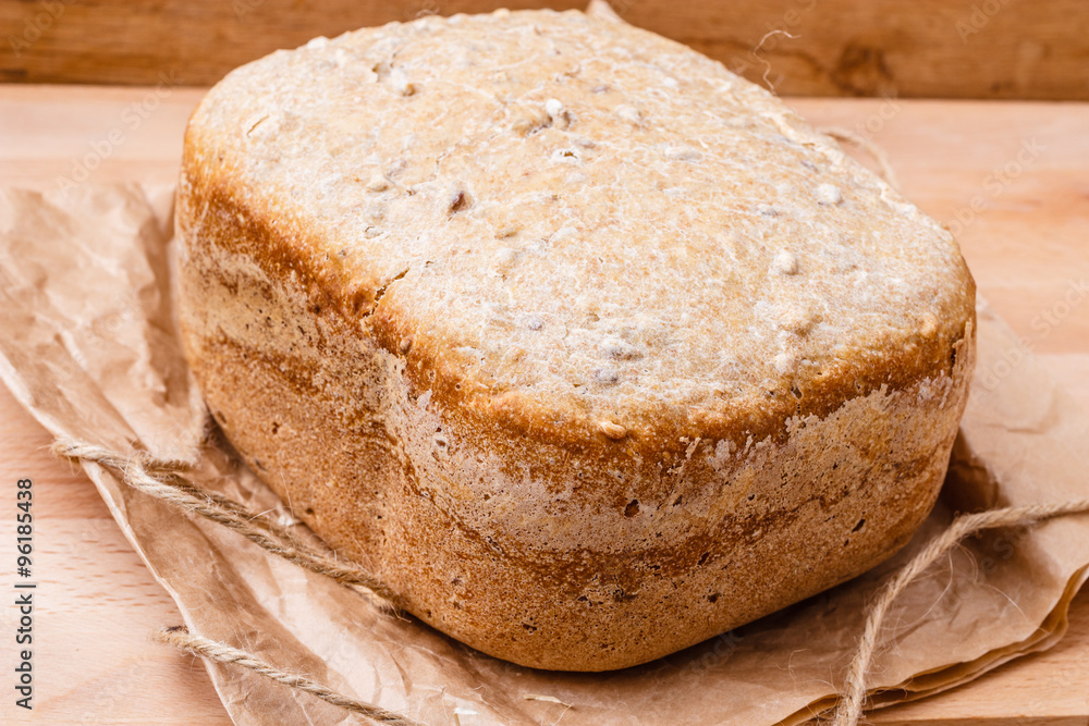 loaf of bread on backing paper loaf of bread on backing paper