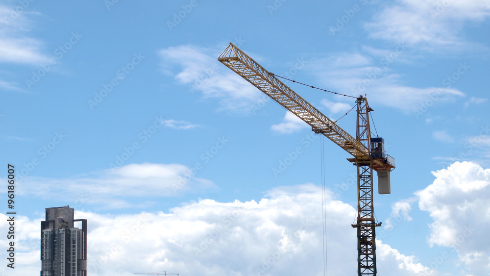 Industrial landscape with cranes on the blue sky Industrial landscape with cranes on the blue sky