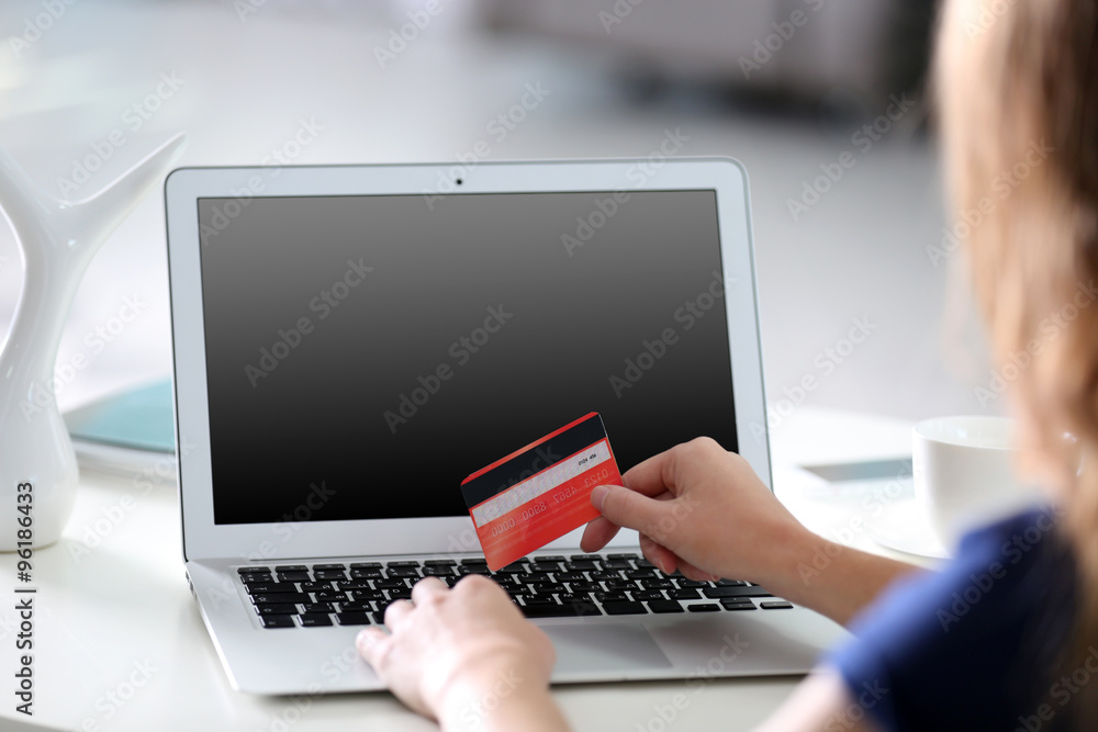 Female making online payment, close up Female making online payment, close up