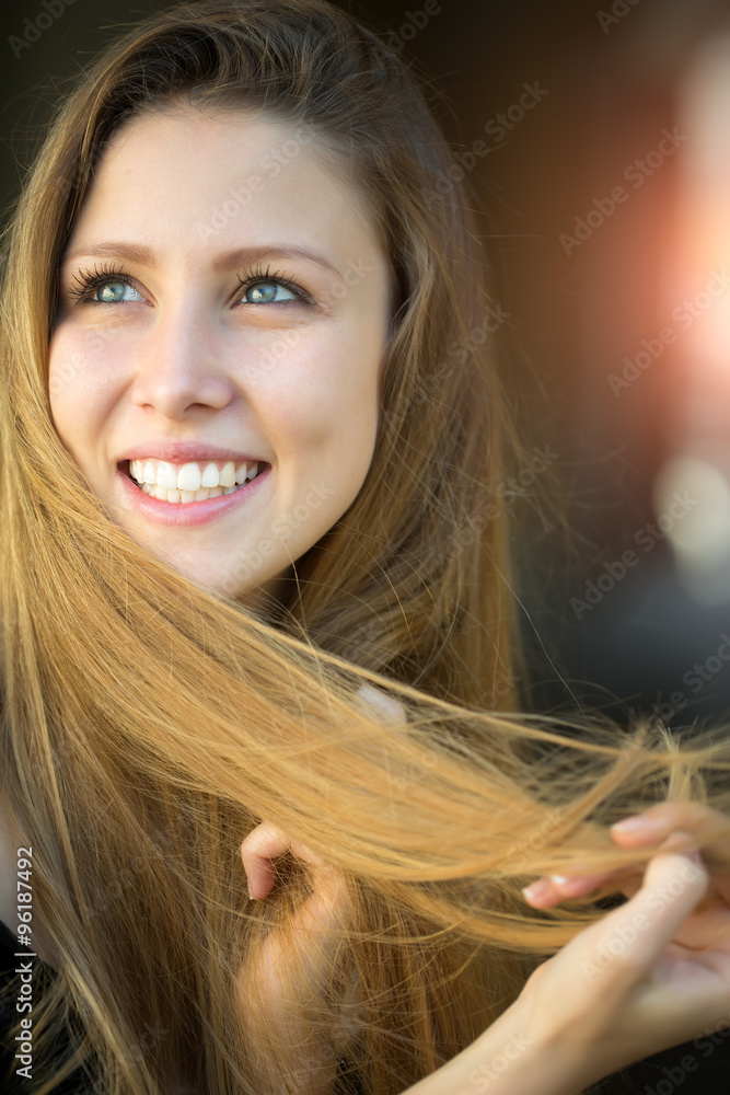 Fototapeta premium Smiling young blonde girl