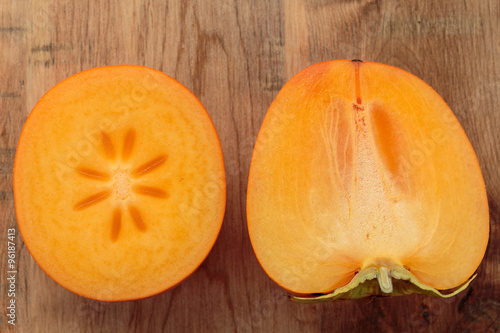 Persimmon, Kaki on rustic wooden table background