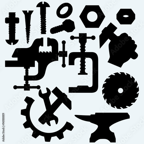 Set of tools: vice, spanner, hammer, Circular saw blade, anvil and screws. Isolated on blue background. Vector silhouettes