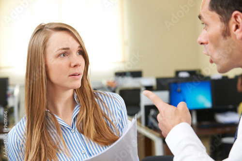 Aggressive Businessman Shouting At Female Colleague